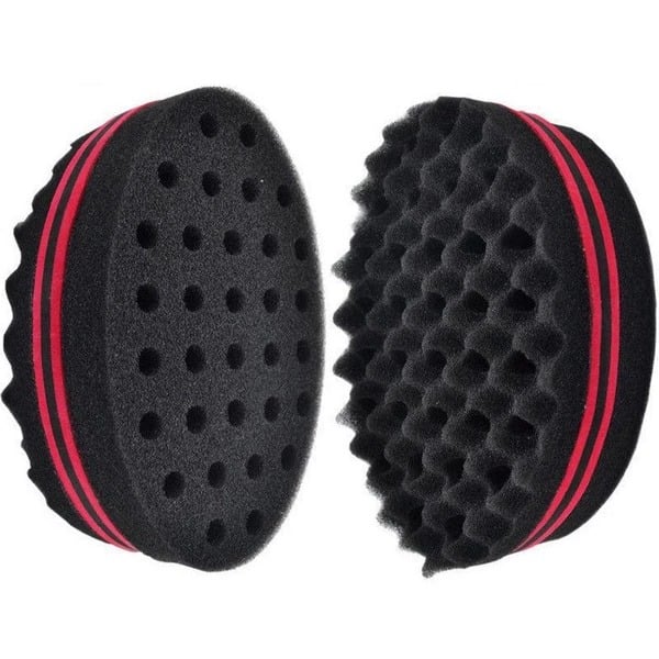 Perforated and wavy sides of a black sponge hair twist brush
